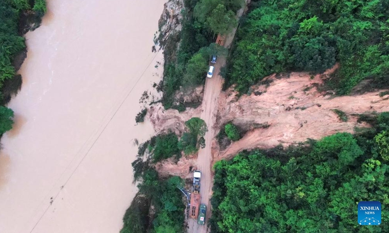 An aerial drone photo taken on April 21, 2024 shows a road damaged by landslides in Jiangwan Town of Wujiang District, Shaoguan City, south China's Guangdong Province. A total of 38 hydrological stations at 24 rivers in south China's Guangdong Province have reported water levels surpassing the alert threshold as of 4 p.m. on Sunday, according to the provincial department of water resources. (Xinhua/Lu Hanxin)