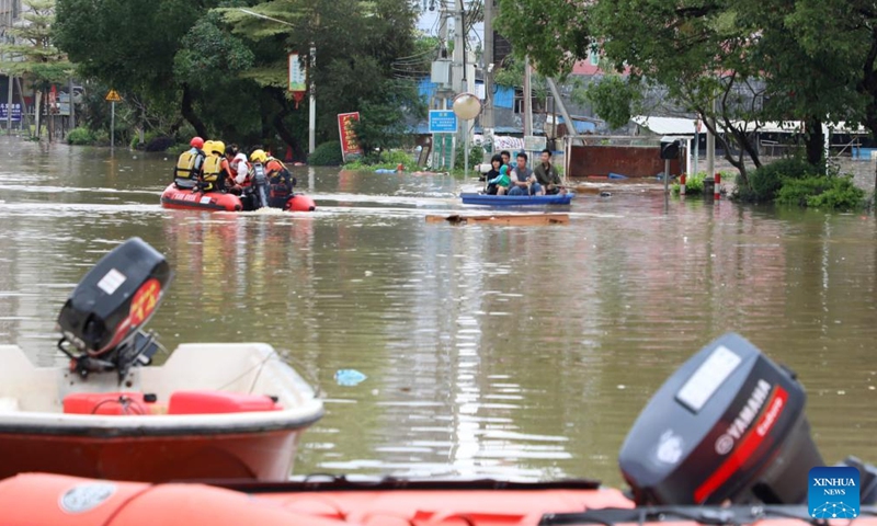 Resucers work in Hanguang Town of Qingyuan, south China's Guangdong Province, April 21, 2024. A total of 38 hydrological stations at 24 rivers in south China's Guangdong Province have reported water levels surpassing the alert threshold as of 4 p.m. on Sunday, according to the provincial department of water resources. (Xinhua/Huang Guobao)