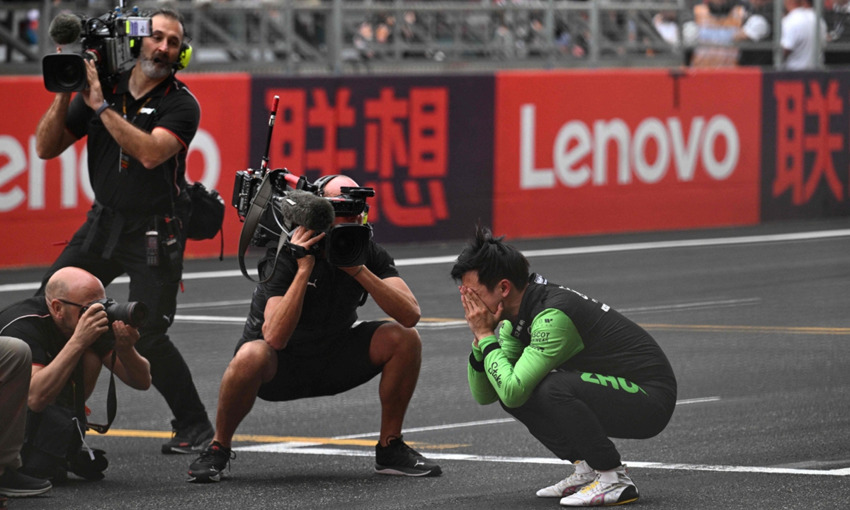 Chinese driver Zhou Guanyu bursts into tears after ending his maiden Chinese Grand Prix at the Shanghai International Circuit on April 21, 2024. Photo: VCG
