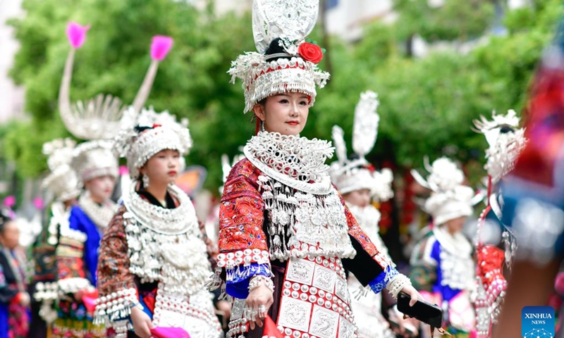 People of Miao ethnic group attend a parade to celebrate the Miao Sisters Festival in Taijiang County, southwest China's Guizhou Province, April 21, 2024.