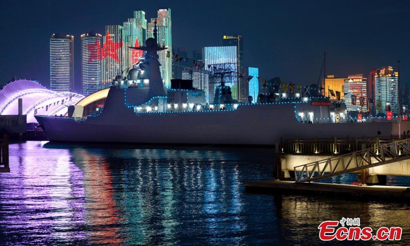 Night view of the guided-missile destroyer Kaifeng of the People's Liberation Army (PLA) navy at the Qingdao International Sailing Center pier in east China's Shandong Province, April 22, 2024. The Chinese People's Liberation Army (PLA) Navy hosted a series of activities to celebrate its 75th founding anniversary in Qingdao.Photo: China News Service

