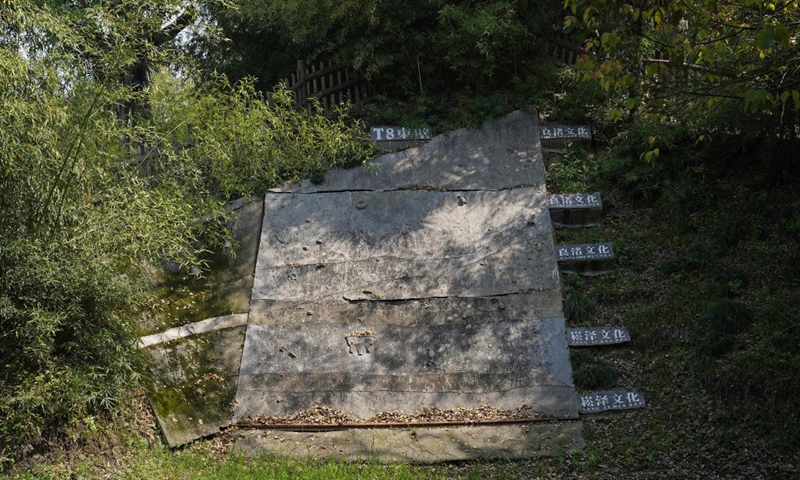 This photo taken on April 10, 2024 shows a restoration diagram of five soil horizons in different colors one above another representing different civilizations at Fuquanshan Ancient Cultural Site in east China's Shanghai.