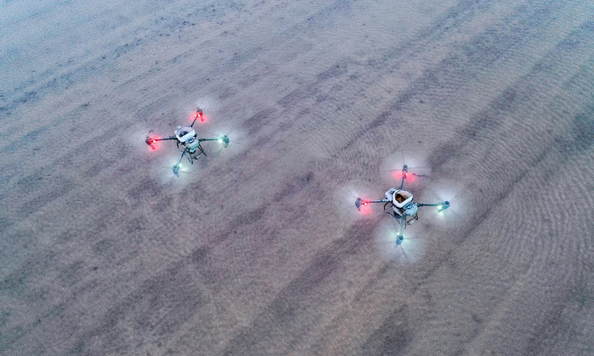 Drones plant rice in Liuyuan town of Aksu Prefecture, Xinjiang Uygur Autonomous Region on April 22, 2024. Photo: Zhou Peng of Xinjiang Daily