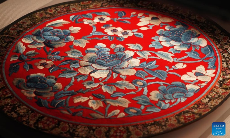 This photo taken on April 16, 2024 shows an embroidery work containing peony elements at Peony Pavilion in Luoyang, central China's Henan Province. As an imperial capital during 13 dynasties, Luoyang claims to have the country's best peonies. In recent years, Luoyang has actively explored the culture related to peony flowers, encouraging the development of peony-themed porcelain, painting, and many other characteristic activities containing peony elements.(Photo: Xinhua)