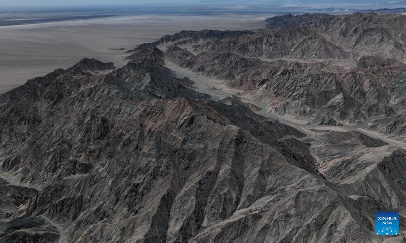 An aerial drone photo taken on April 20, 2024 shows a view of Serteng Mountain in Lenghu Town in the Mongolian-Tibetan Autonomous Prefecture of Haixi, northwest China's Qinghai Province. The Qaidam Basin in northwest China is home to a unique landscape which consists of salt lakes, the Gobi desert and the wind-eroded rocks known as yardang.(Photo: Xinhua)