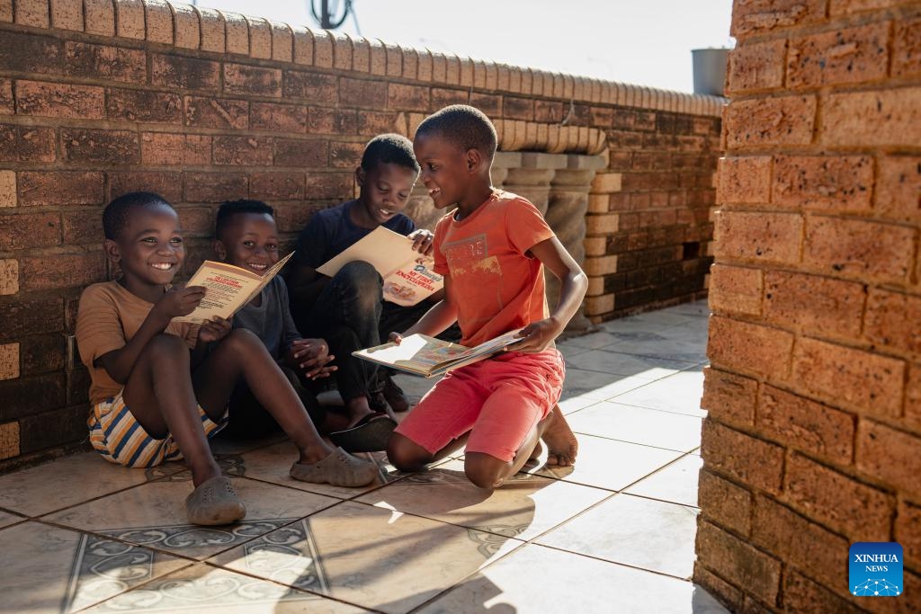 Children read books at a book club on the occasion of World Book Day in Soweto, South Africa, April 23, 2024.(Photo: Xinhua)