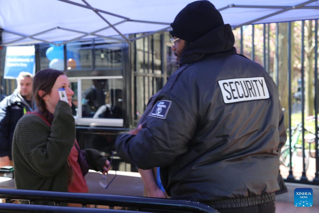 A student presents her university ID to enter Columbia University's Morningside Heights campus in New York City, the United States, April 22, 2024. All classes at Columbia University went virtual starting on Monday as divisive demonstrations and debates around the Israel-Hamas conflict heated up on campus recently.(Photo: Xinhua)