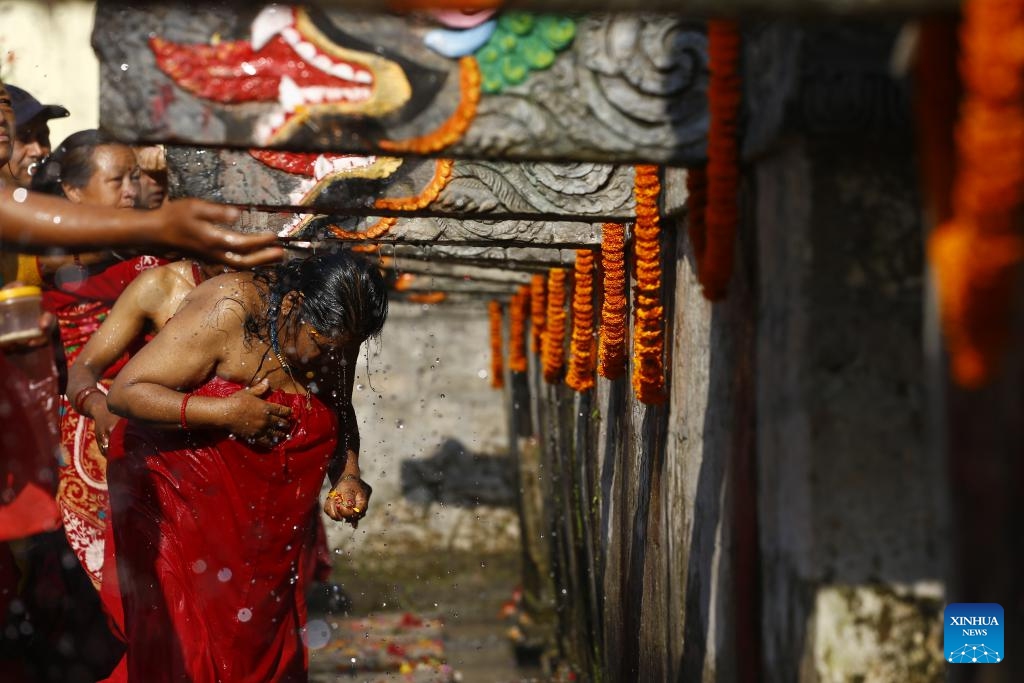People take a holy bath during the Baishak Asnan festival in Kathmandu, Nepal, April 23, 2024. The locals believe that taking a holy bath on this day purifies one's spirit and makes one free from skin diseases.(Photo: Xinhua)