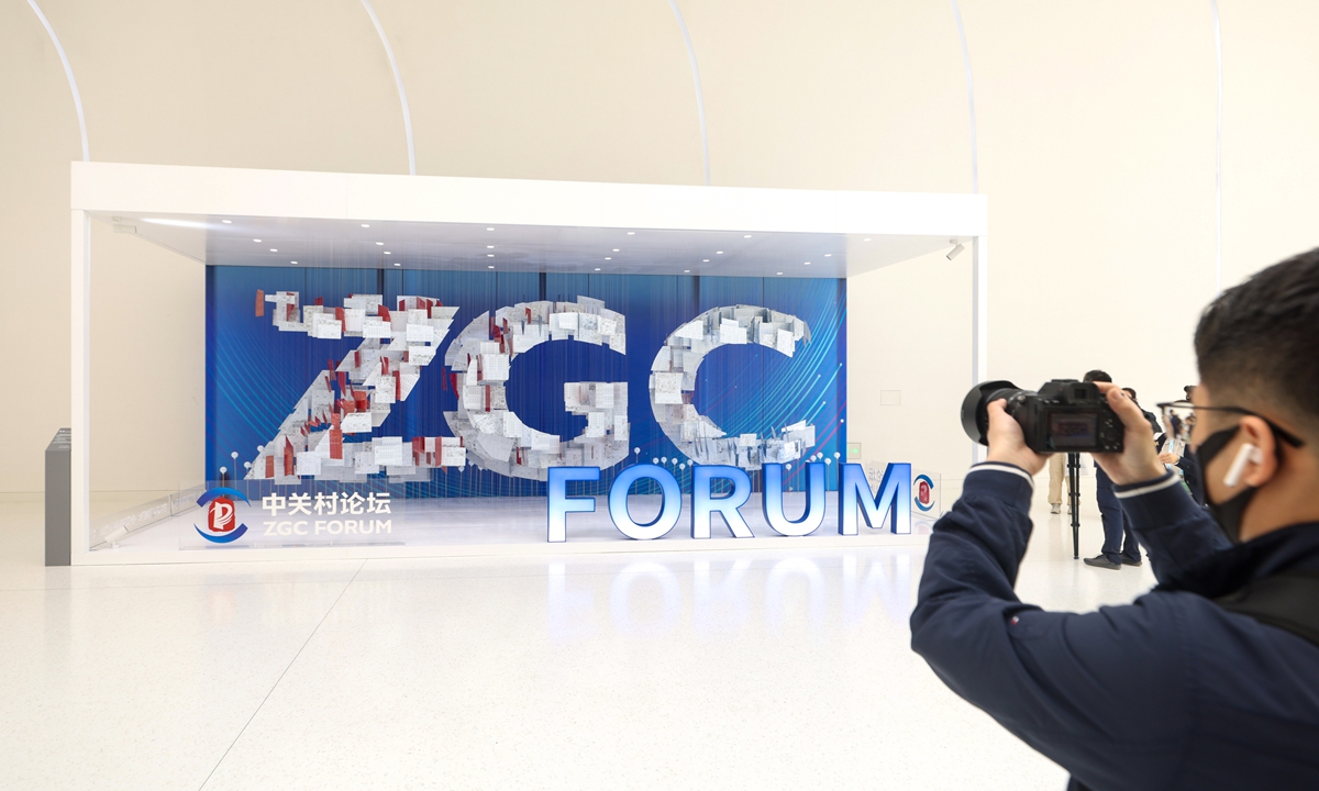 A journalist takes pictures of an art installation during a tour at the new venue for the Zhongguancun Forum (ZGC Forum) at the Zhongguancun International Innovation Center in Beijing on April 24, 2024. The installation is made of 1 ton of used electronic components and 800 used circuit boards. Themed Innovation: Building a Better World, this year's ZGC Forum runs from April 25 to 29. Photo: VCG