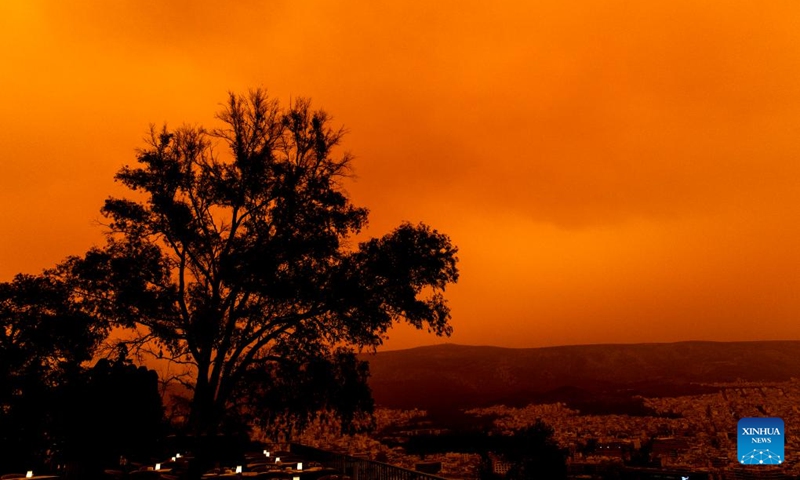 Buildings are shrouded in dust seen from Filopappou Hill, in Athens, Greece, on April 23, 2024.(Photo: Xinhua)