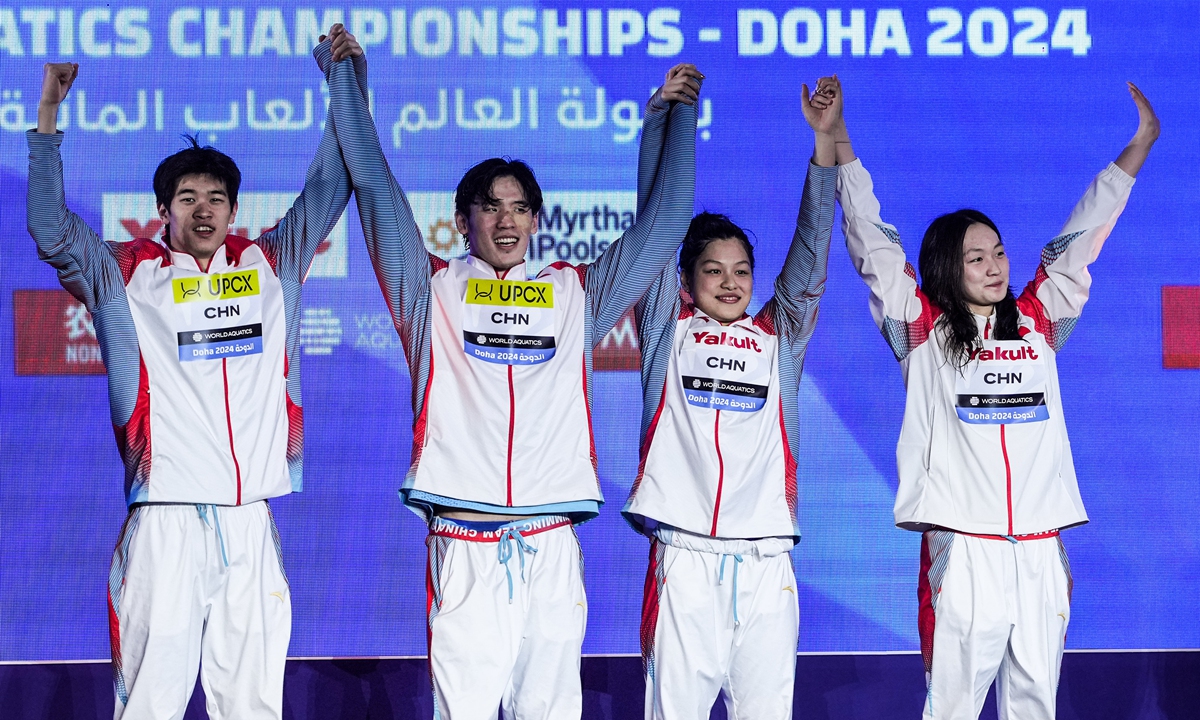 (From left) Gold medalists Pan Zhanle, Wang Haoyu, Yu Yiting and Li Bingjie celebrate after winning the mixed 4x100m freestyle final at the World Aquatics Championships on February 17, 2024 in Doha, Qatar.Photo: VCG