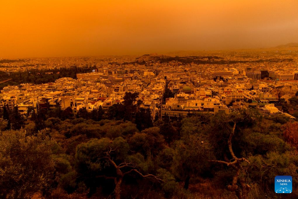 Buildings are shrouded in dust seen from Filopappou Hill, in Athens, Greece, on April 23, 2024.(Photo: Xinhua)