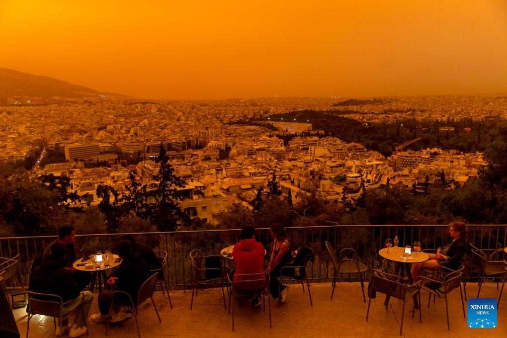 Buildings are shrouded in dust seen from Filopappou Hill, in Athens, Greece, on April 23, 2024.(Photo: Xinhua)