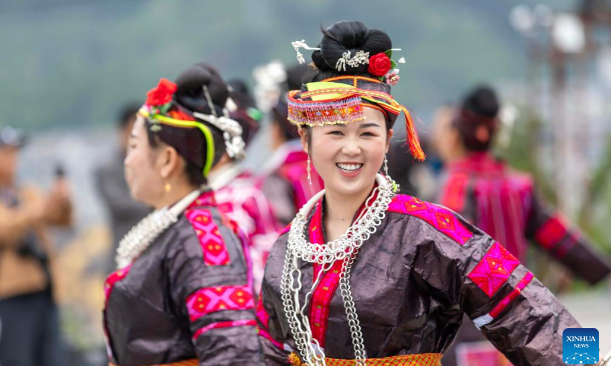 People of Miao ethnic group perform Lusheng dance at a plaza in Jianhe County, southwest China's Guizhou Province, May 1, 2024. Photo:Xinhua