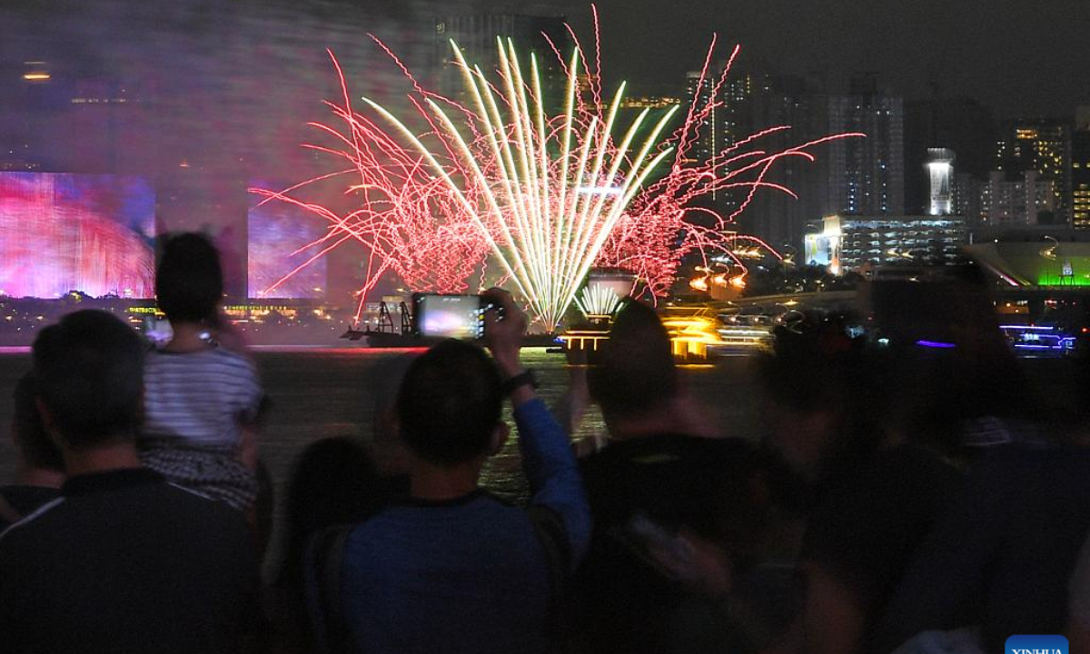 People watch a firework show at the Victoria Harbor in Hong Kong, south China, May 1, 2024. Photo:Xinhua