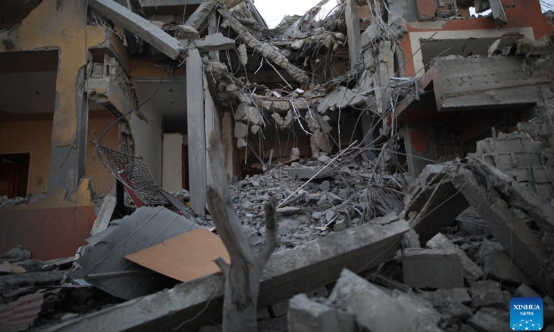 Photo taken on April 24, 2024 shows a building destroyed in an Israeli airstrike in central Gaza Strip city of Deir el-Balah. The Palestinian death toll in the Gaza Strip from ongoing Israeli attacks has risen to 34,262, the Hamas-run Health Ministry said on Wednesday.(Photo: Xinhua)