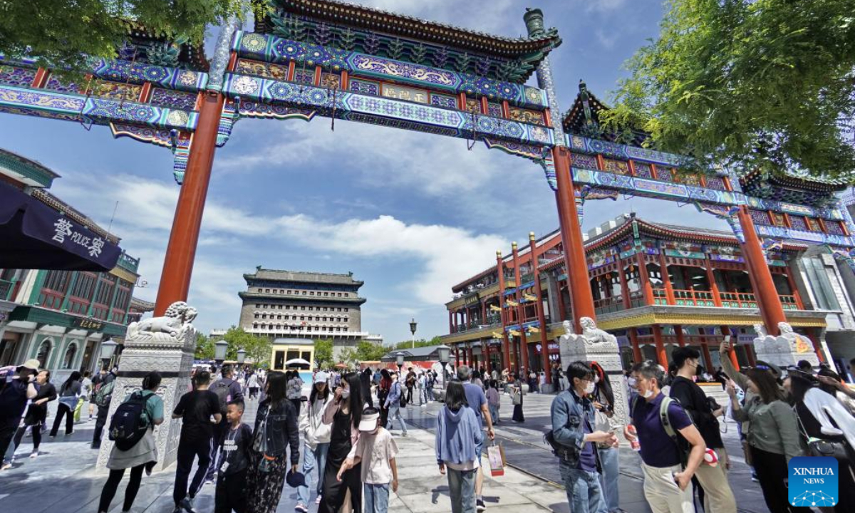 Tourists visit the Qianmen commercial district in Beijing, capital of China, May 1, 2024. Photo:Xinhua