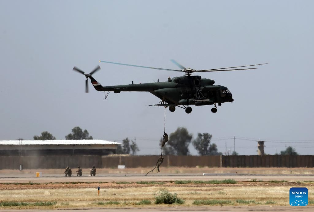 Iraqi Special Forces take part in a training exercise during a celebration marking the 93rd anniversary of the establishment of Iraqi Air Force in Salahudin Province, Iraq, on April 24, 2024.(Photo: Xinhua)