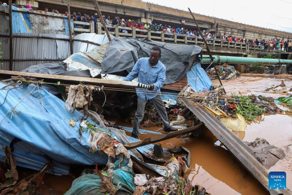 A resident salvages his belongings after heavy rains in the Mathare slums of Nairobi, Kenya, on April 24, 2024. Kenya is experiencing heavy rains that have disrupted normal business across the East African country, resulting in the loss of more than 38 lives and the destruction of property.(Photo: Xinhua)