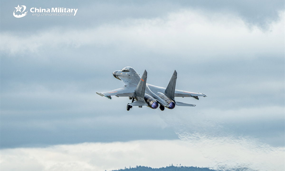 A fighter jet attached to an aviation brigade with the air force under the Chinese PLA Eastern Theater Command soars into the air during a round-the-clock flight training exercise on April 8, 2024. Photo:China Military