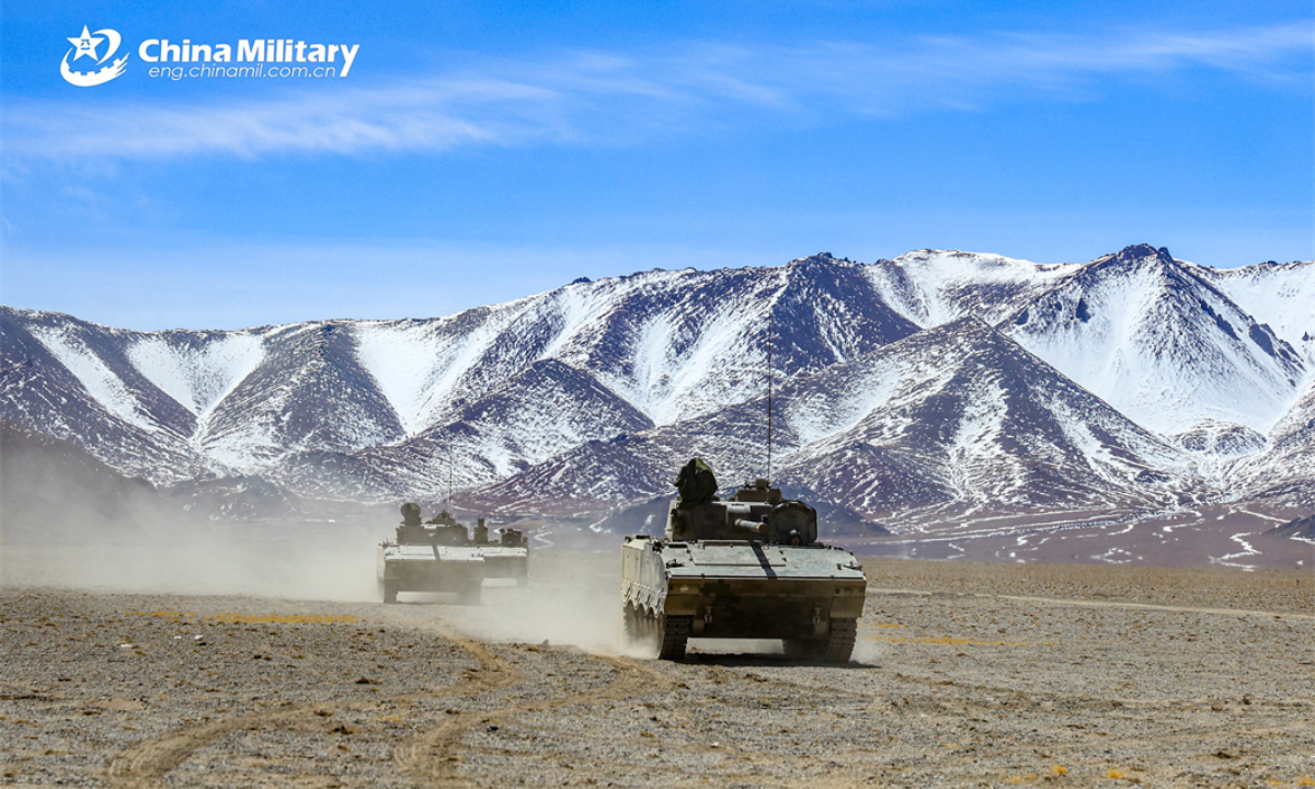 Armored vehicles attached to a regiment under the PLA Xinjiang Military Command rumble towards the designated field during a driving skill training exercise in late April, 2024. (eng.chinamil.com.cn/Photo by Guo Zhixiang)