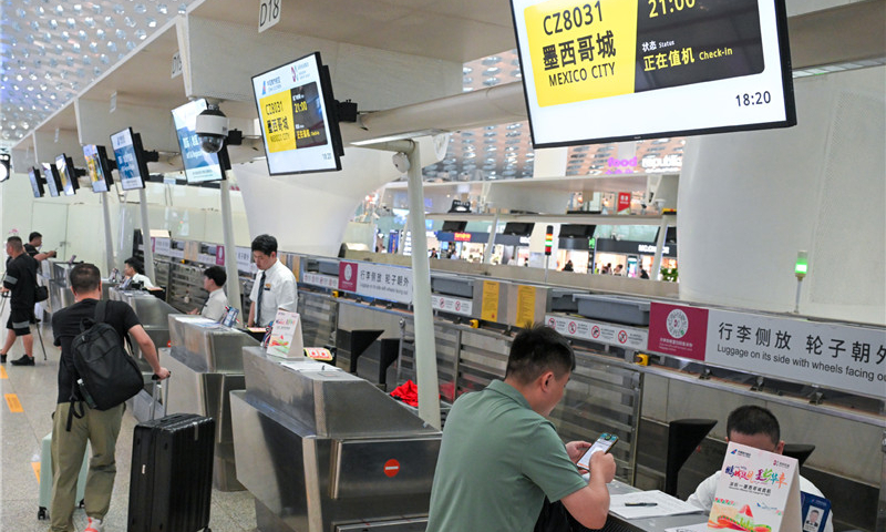 A passenger checks in for a flight to Mexico City at Shenzhen Baoan International Airport in Shenzhen, south China's Guangdong Province, on May 11, 2024. Photo: Xinhua