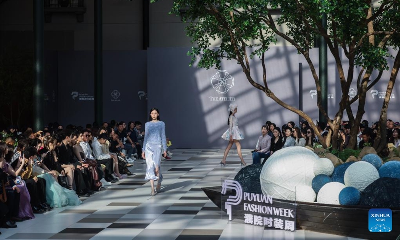 Models present creations at THE ATELIER show during the Puyuan fashion week at the Puyuan Fashion Resort in Puyuan Town of Tongxiang City, east China's Zhejiang Province, April 24, 2024. Puyuan is a major knitwear center in China with strong manufacturing capability. The fashion week is held here on Wednesday, hoping to put local knitwear on the global fashion podium.(Photo: Xinhua)