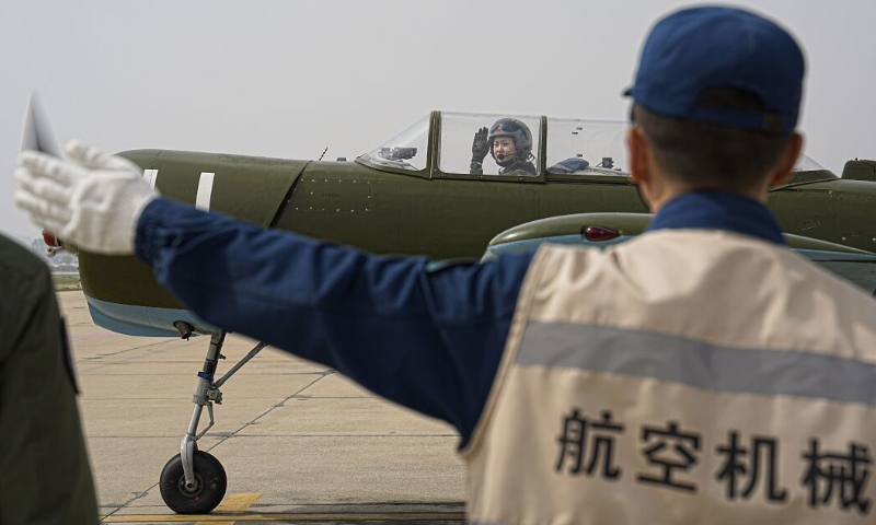 A trainee prepares for takeoff on her maiden flight. Photo: Chen Chao 
