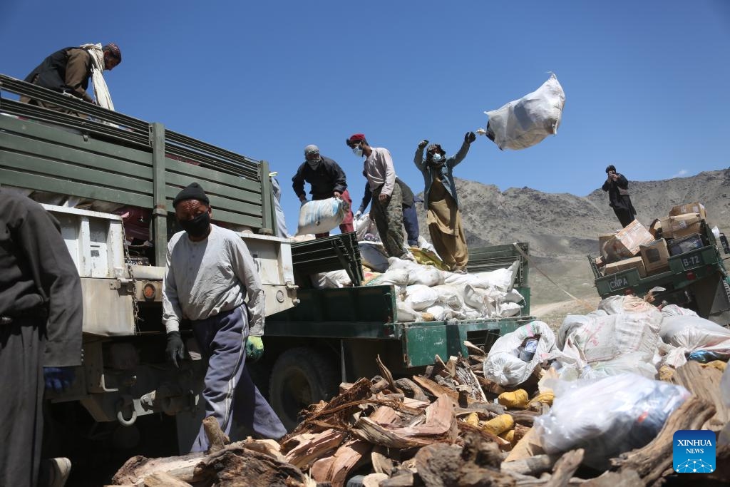 Afghan security force members prepare to burn illicit drugs and the objects used in manufacturing drugs in Kabul, Afghanistan, April 23, 2024.(Photo: Xinhua)