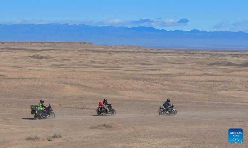 Motorcyclists experience off-road motorcycling in Urho District of Karamay, northwest China's Xinjiang Uygur Autonomous Region, May 2, 2024. During the May Day holiday, Urho District of Karamay City has become a popular travel destination for tourists from all over the country. Various activities such as low-altitude flight, no-man's land crossing, RV camping, and off-road motorcycling have been carried out here to meet the diverse and personalized needs of tourists. In recent years, Xinjiang has taken full advantages of its rich natural resources to develop outdoor tourism projects and thus new growth opportunities have emerged in Xinjiang's thriving tourism industry. (Xinhua/Ding Lei)