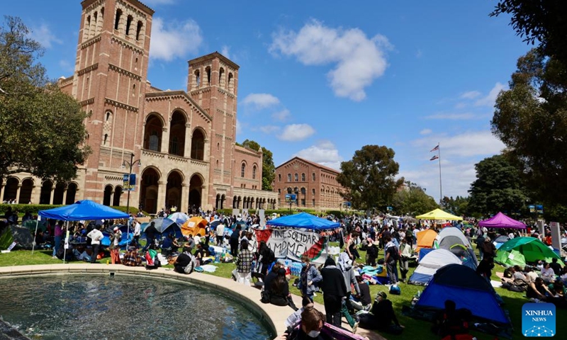 People participate in a pro-Palestinian protest at the University of California, Los Angeles (UCLA), California, the United States, on April 25, 2024. Hundreds of protesters gathered and built a protest encampment in support of Palestinians on Thursday at UCLA, one of the top public universities in the United States.(Photo: Xinhua)