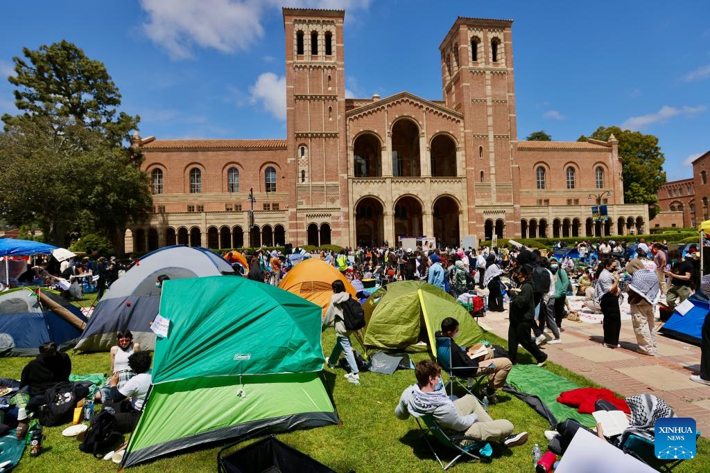People participate in a pro-Palestinian protest at the University of California, Los Angeles (UCLA), California, the United States, on April 25, 2024. Hundreds of protesters gathered and built a protest encampment in support of Palestinians on Thursday at UCLA, one of the top public universities in the United States.(Photo: Xinhua)