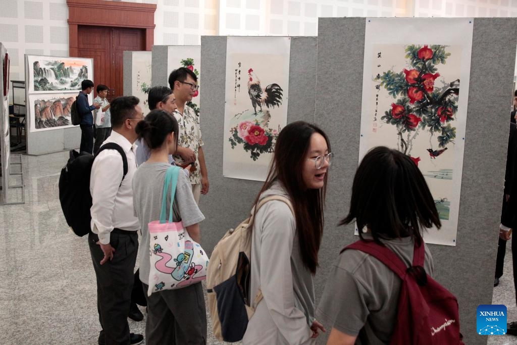 People visit a Cambodia-China paintings exhibition in Phnom Penh, Cambodia on April 26, 2024. A Cambodia-China paintings exhibition opened in Phnom Penh, capital of Cambodia, on Friday, attracting scores of visitors. Jointly organized by the Royal Academy of Cambodia and China's Jiujiang University, the half-day event displayed dozens of paintings featuring scenery, culture and tradition of both countries as well as Chinese calligraphy.(Photo: Xinhua)