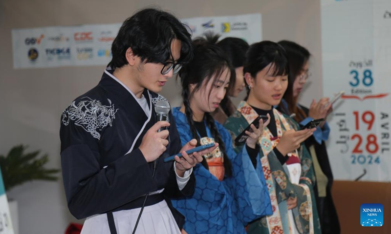 Chinese students studying in Tunisia recite Arabic poetry during the Chinese Culture Day in occasion of the 38th Tunis International Book Fair in Tunis, Tunisia, April 24, 2024.(Photo: Xinhua)