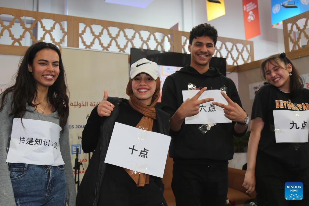 Tunisian high school students perform a talk show in Chinese during the Chinese Culture Day in occasion of the 38th Tunis International Book Fair in Tunis, Tunisia, April 24, 2024.(Photo: Xinhua)