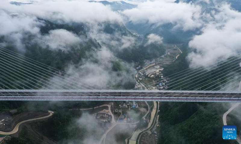 An aerial drone photo taken on April 27, 2024 shows the Longli River bridge in Longli County, southwest China's Guizhou Province. The 1,260-meter-long bridge was completed and opened to traffic on Saturday. Photo: Xinhua