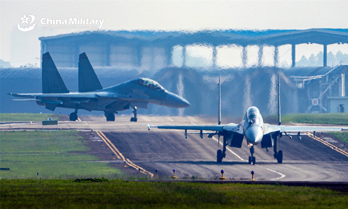Fighter jets attached to an aviation brigade with the air force under the PLA Southern Theater Command taxi on the runway in formation during a flight training exercise on April 19, 2024. (eng.chinamil.com.cn/Photo by Zhao Yutong)