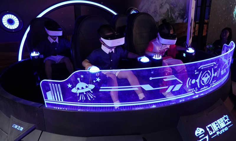 Children play a VR game at a science fiction carnival alongside the China Science Fiction Convention (CSFC) 2024 in Beijing, capital of China, April 27, 2024. Photo: Xinhua