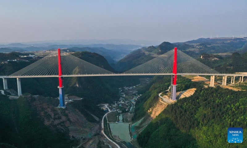 An aerial drone photo taken on April 26, 2024 shows the Longli River bridge in Longli County, southwest China's Guizhou Province. The 1,260-meter-long bridge was completed and opened to traffic on Saturday. Photo: Xinhua