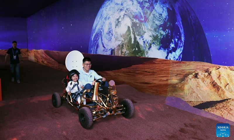 Visitors take a simulated rover at a science fiction carnival alongside the China Science Fiction Convention (CSFC) 2024 in Beijing, capital of China, April 27, 2024. Photo: Xinhua