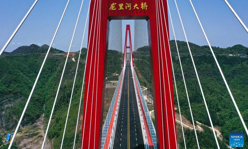 An aerial drone photo taken on April 27, 2024 shows the Longli River bridge in Longli County, southwest China's Guizhou Province. The 1,260-meter-long bridge was completed and opened to traffic on Saturday. Photo: Xinhua