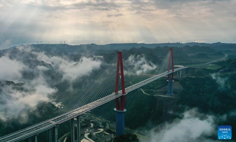 An aerial drone photo taken on April 27, 2024 shows the Longli River bridge in Longli County, southwest China's Guizhou Province. The 1,260-meter-long bridge was completed and opened to traffic on Saturday. Photo: Xinhua