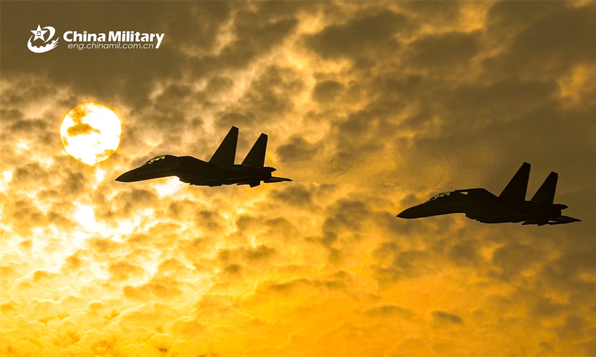 Fighter jets attached to an aviation brigade with the air force under the PLA Southern Theater Command fly in formation at sunset during a flight training exercise on April 19, 2024. (eng.chinamil.com.cn/Photo by Zhao Yutong)