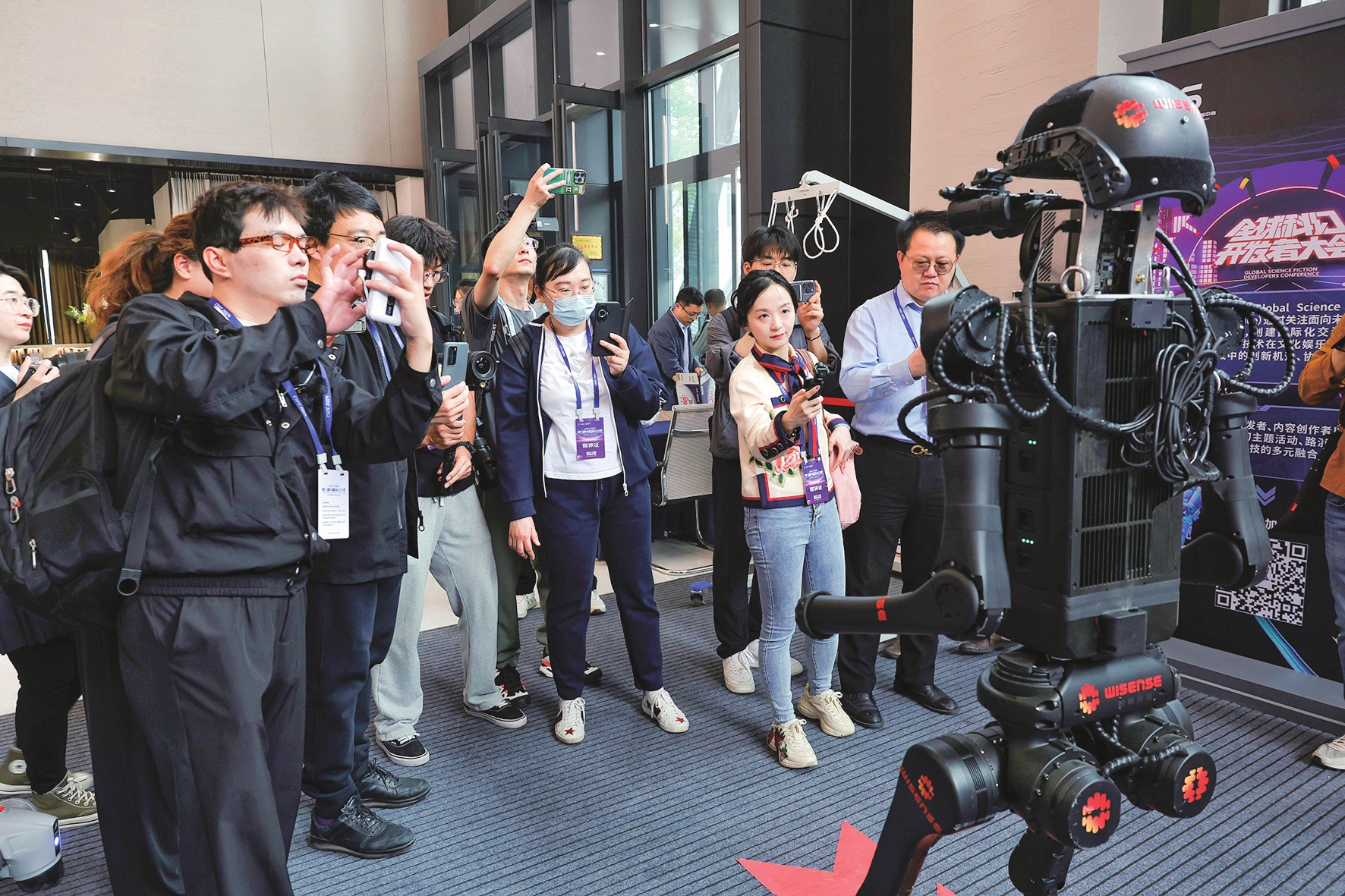 Visitors take a picture of a robot at the eighth China Science Fiction Convention in Beijing, on April 27, 2024.Photo: Li Hao/GT