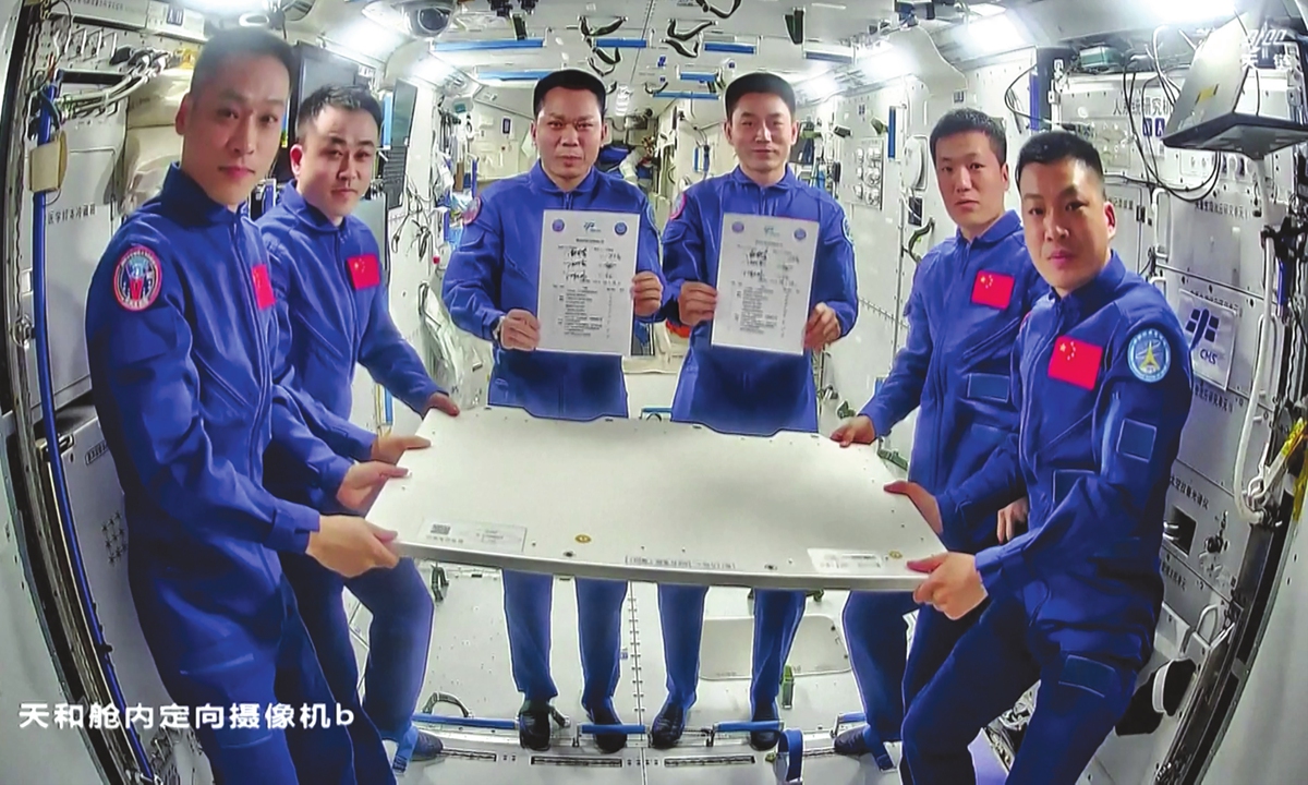 China's Shenzhou-17 crew hold a handover ceremony with the Shenzhou-18 crew and transfer the operation of the space station to the latter on April 28, 2024. The three astronauts -Tang Hongbo (3rd from left), Tang Shengjie (2nd from left) and Jiang Xinlin (1st from left) - will return to the Dongfeng landing site in North China's Inner Mongolia Autonomous Region on April 30. Photo: VCG
