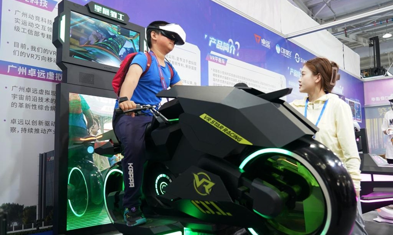 A boy plays a VR game at a science fiction carnival alongside the China Science Fiction Convention (CSFC) 2024 in Beijing, capital of China, April 27, 2024. The CSFC 2024 kicked off Saturday at the Shougang Park in Beijing, with opening ceremony, forums, industry promotional events and film screenings scheduled. A science fiction carnival is also held during this year's convention. Photo: Xinhua