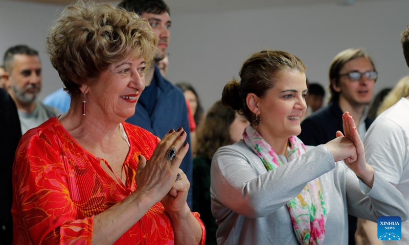 The audience react during a lecture themed feel the beauty of Tai Chi and share the joy of health at the Chinese Cultural Center in Bucharest, Romania, April 26, 2024. The World Tai Chi Day is celebrated on the last Saturday of April every year. Photo: Xinhua