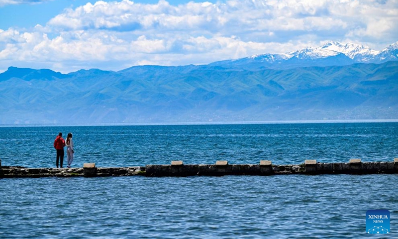 People enjoy the scenery of Ohrid Lake in Ohrid, North Macedonia, April 27, 2024. Photo: Xinhua
