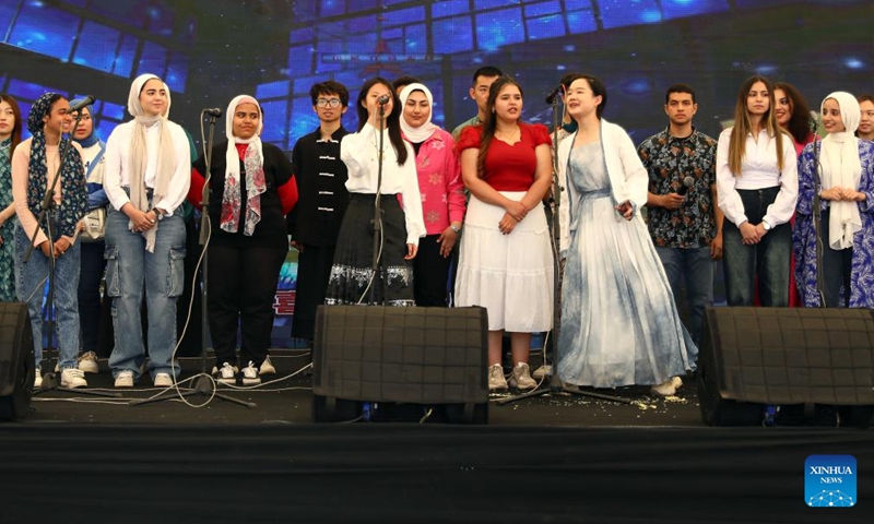 Students and teachers perform a song during a ceremony to celebrate Chinese Language Day in Cairo, Egypt, April 27, 2024. Students studying in Egyptian colleges celebrated Saturday the United Nations Chinese Language Day with a themed event featuring a concert, food and tea tasting, sketch comedy, and art show. Photo: Xinhua