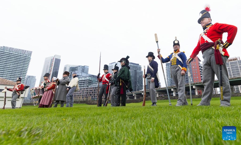 Dressed-up performers attend a historical fashion show during the Battle of York Day ceremony at Fort York National Historic Site in Toronto, Canada, on April 27, 2024. Hundreds of visitors participated in the 211th anniversary of the Battle of York with special tours and demonstrations on Saturday in Toronto.(Photo: Xinhua)